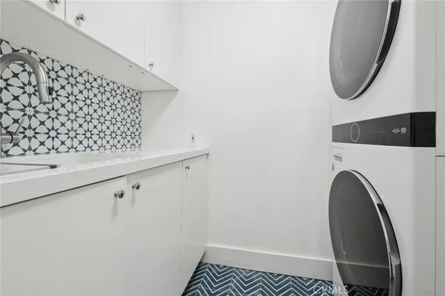 a close view of a utility room with dryer and washer