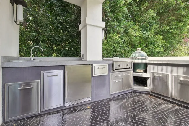 a view of a porch with a table and chairs