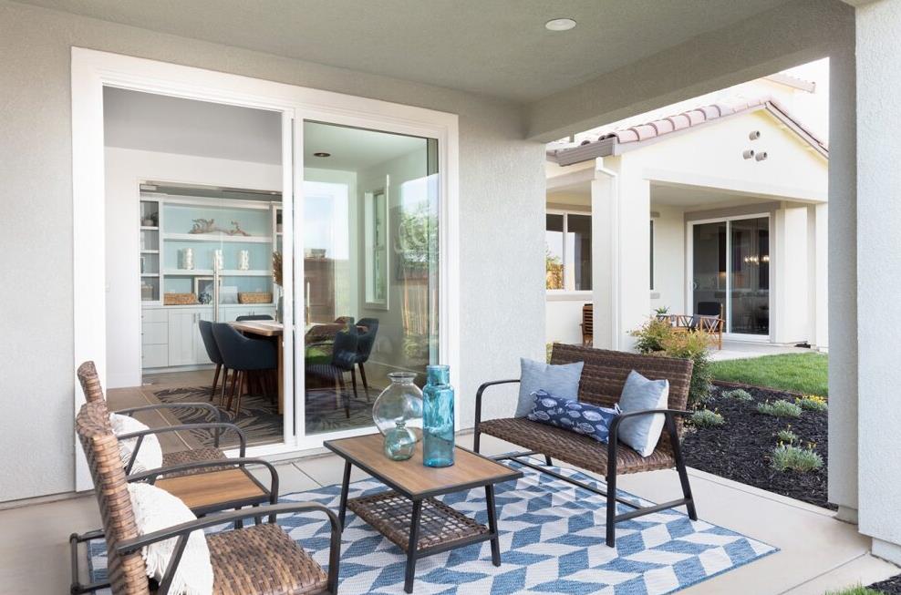 4424 Canyon Coral Way Rancho Cordova, CA 95742 - Photo 12 of 12 a patio with yard glass top table and chairs