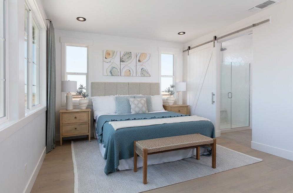 4424 Canyon Coral Way Rancho Cordova, CA 95742 - Photo 9 of 12 a bedroom with a bed and a painting on the wall