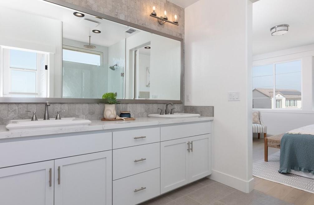 4424 Canyon Coral Way Rancho Cordova, CA 95742 - Photo 10 of 12 a bathroom with double sink and a mirror