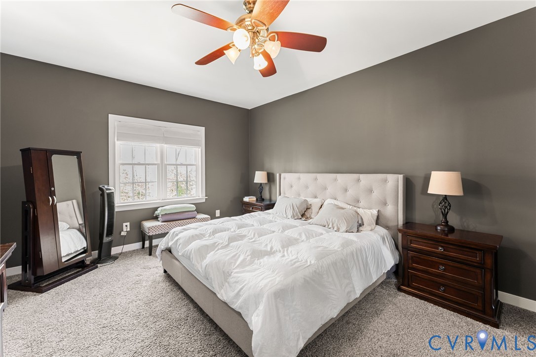 5610 Mt Landing Road Tappahannock, VA 22560 - Photo 16 of 36 Large Master Suite with carpet, ceiling fan, walk-