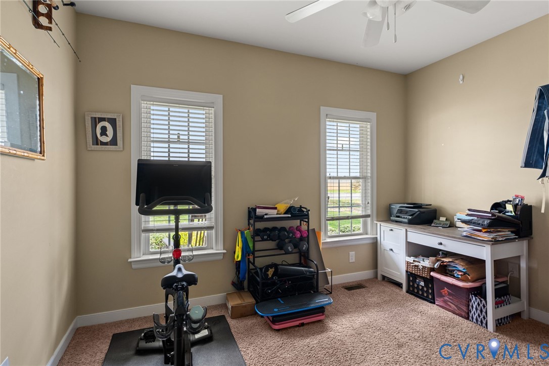 5610 Mt Landing Road Tappahannock, VA 22560 - Photo 21 of 36 2nd downstairs Bedroom with carpet, ceiling fan &