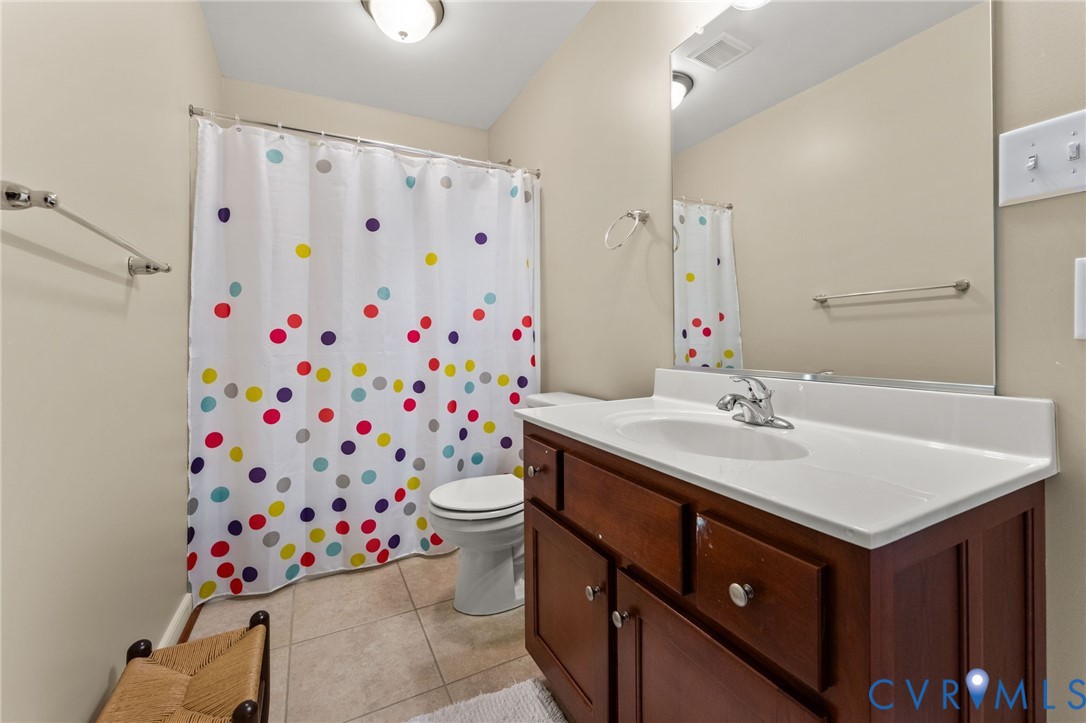 5610 Mt Landing Road Tappahannock, VA 22560 - Photo 28 of 36 Upstairs full Bath with ceramic tile flooring.