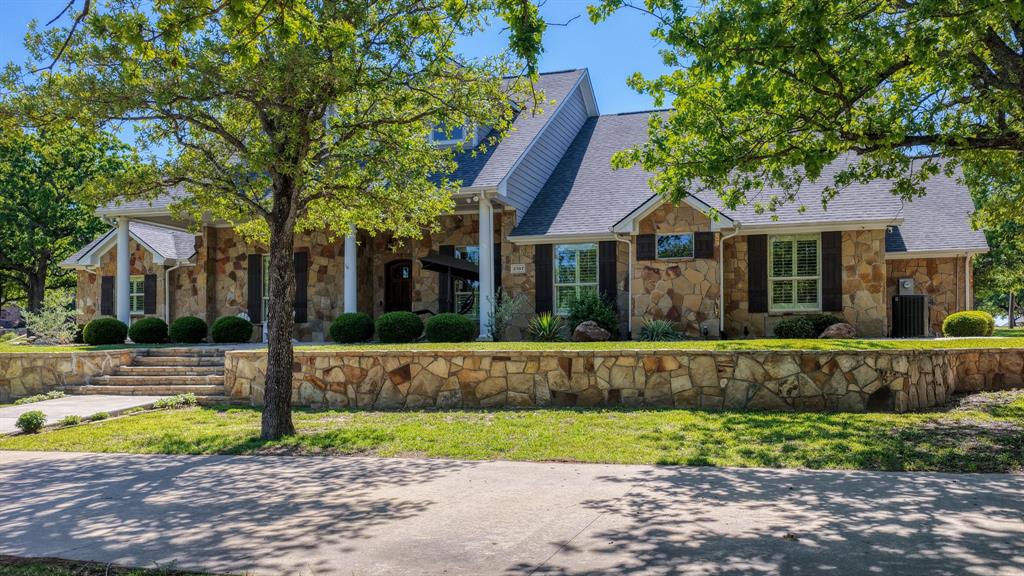 3707 DeCordova Ranch Road Granbury, TX 76049 - Photo 30 of 40 Extensioin flat work all around for extra parking in the circle driveway, driveway to the THREE car attached garages, and the 4th car garage/workshop