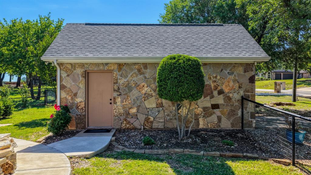 3707 DeCordova Ranch Road Granbury, TX 76049 - Photo 35 of 40 Detached workshop/garage with electric perfect for all sorts of hobbies, workout area, storing equipment, or parking a fourth vehicle if desired.
