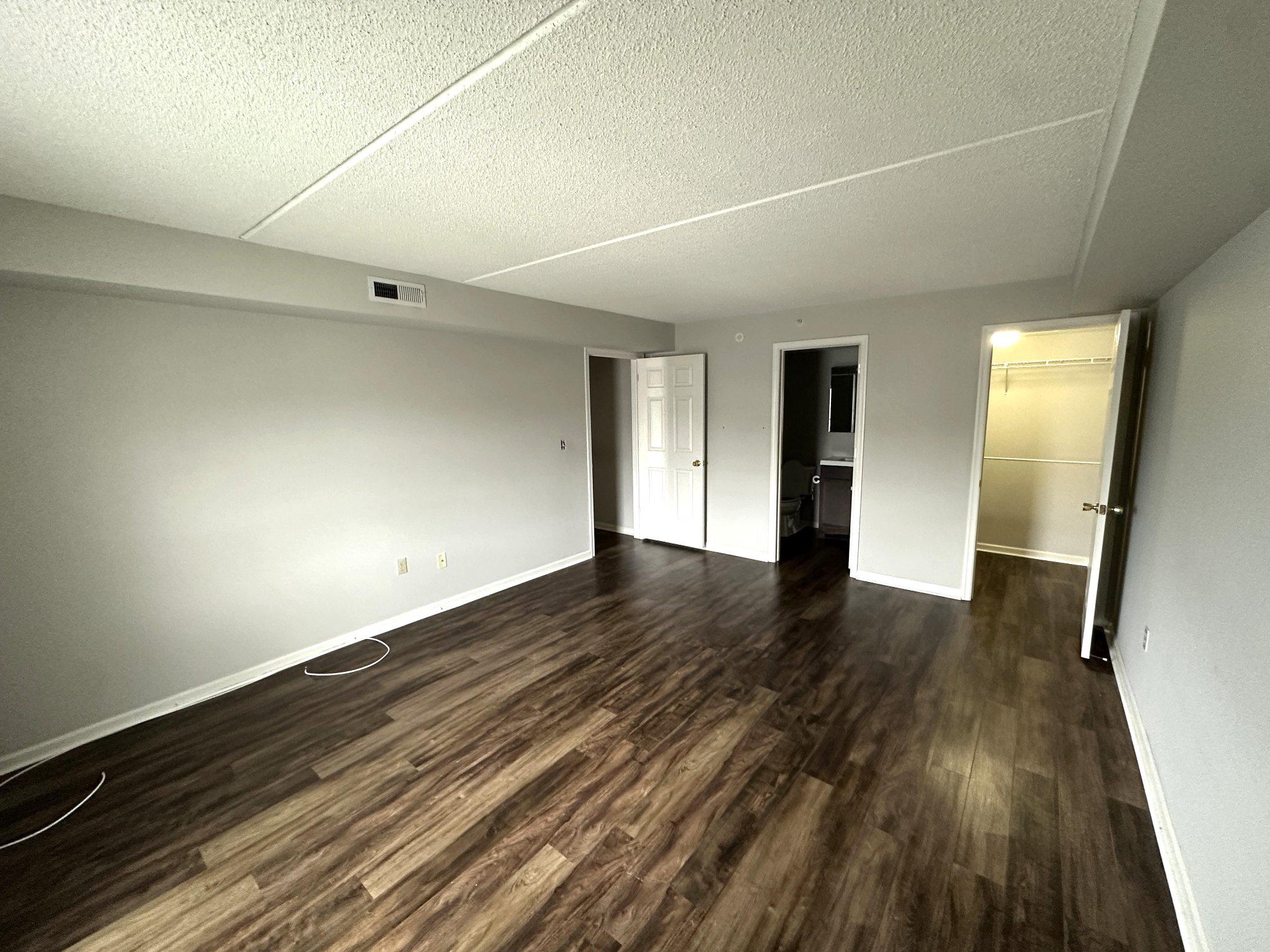 613 Brandon Road Norristown, PA 19403 - Photo 18 of 22 a view of an empty room with wooden floor and a window
