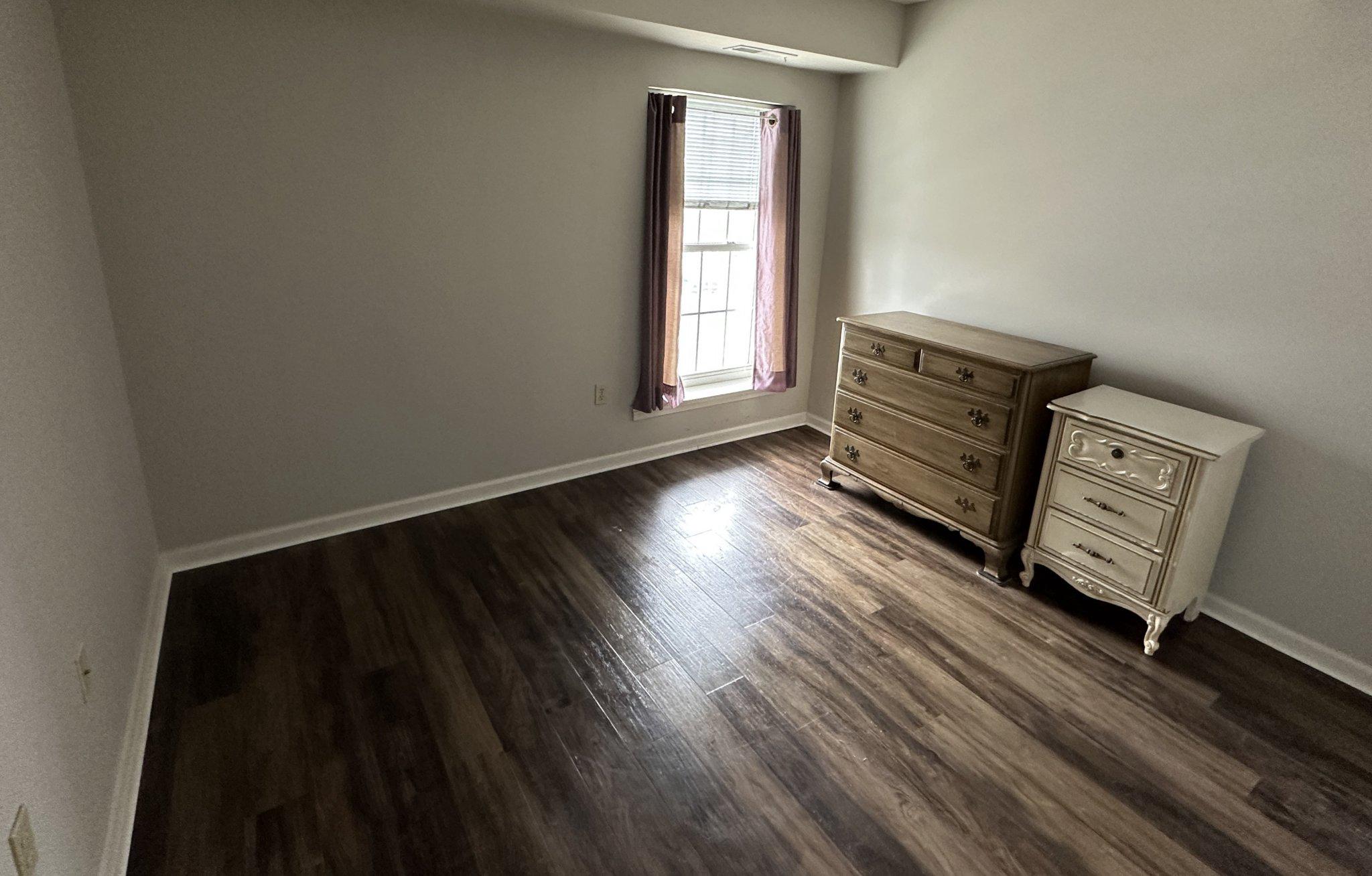 613 Brandon Road Norristown, PA 19403 - Photo 20 of 22 a view of a livingroom with wooden floor and a window