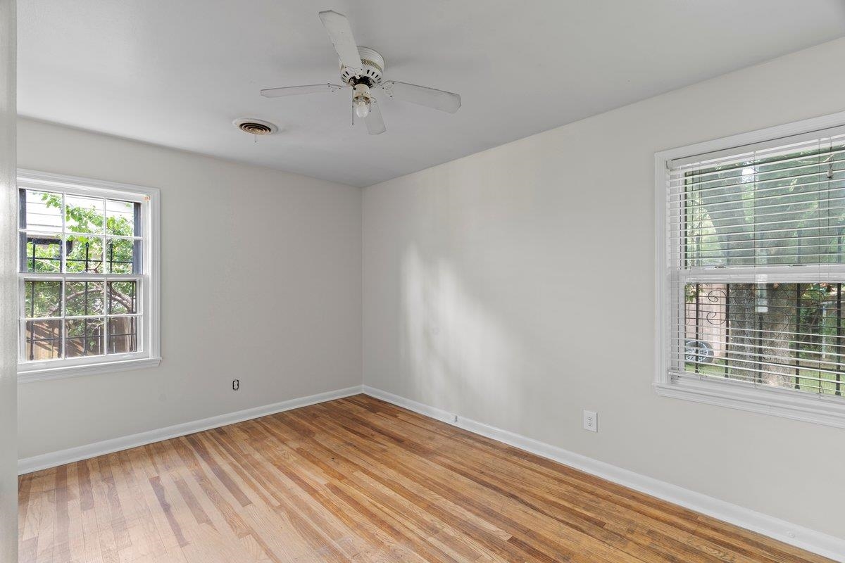 1886 Danville Road Memphis, TN 38117 - Photo 18 of 23 a view of empty room with wooden floor and fan