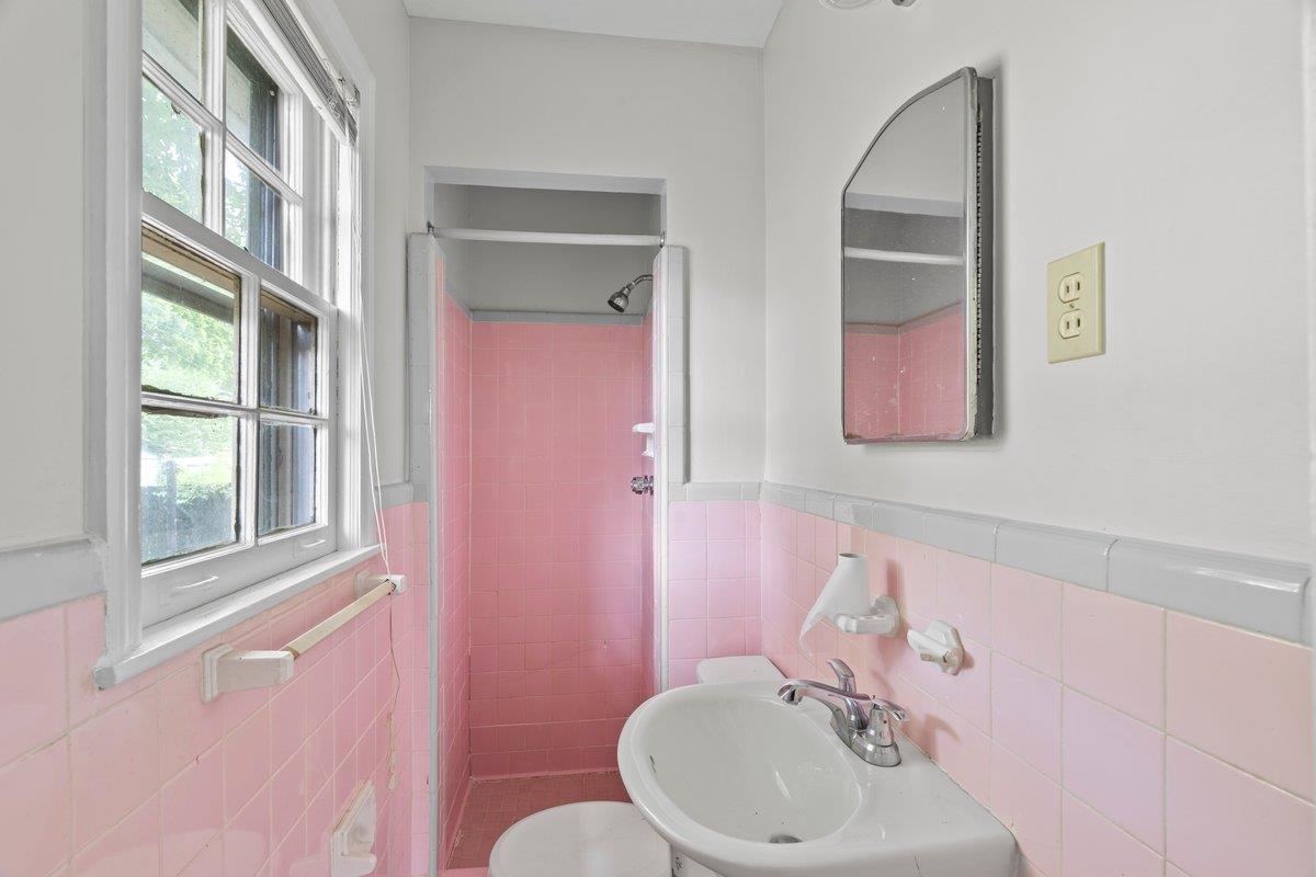 1886 Danville Road Memphis, TN 38117 - Photo 19 of 23 a bathroom with a sink and a mirror