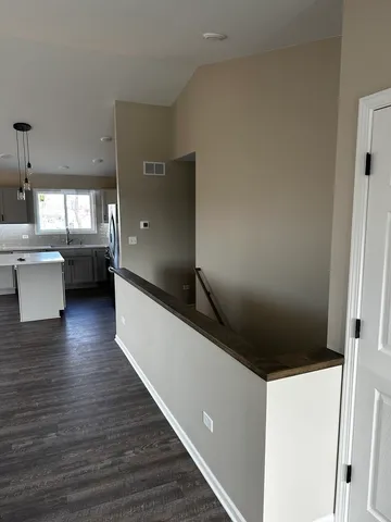 a view of a living room with a wooden floor