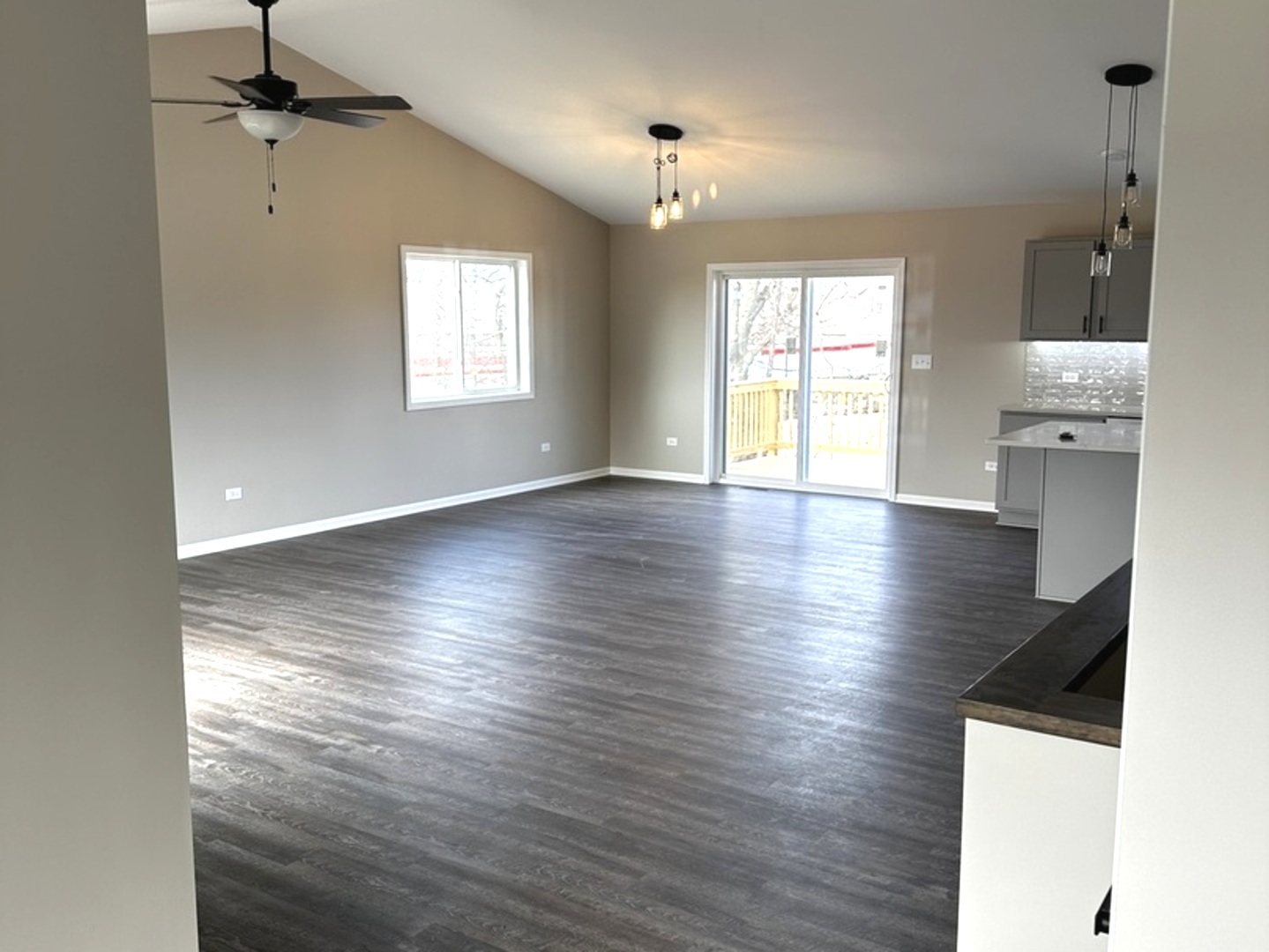 317 Buena Terrace Antioch, IL 60002 - Photo 4 of 10 a view of an empty room with wooden floor and a window