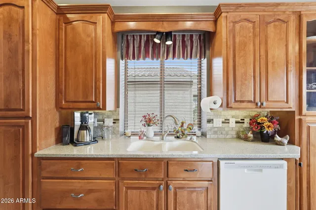 a kitchen with a sink and cabinets