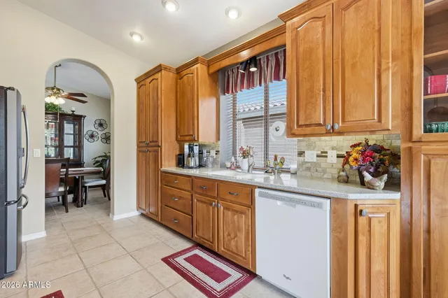 a kitchen with sink cabinets and outdoor view