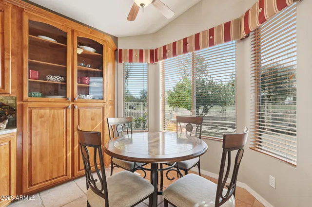 a view of a dining room with furniture window and outside view