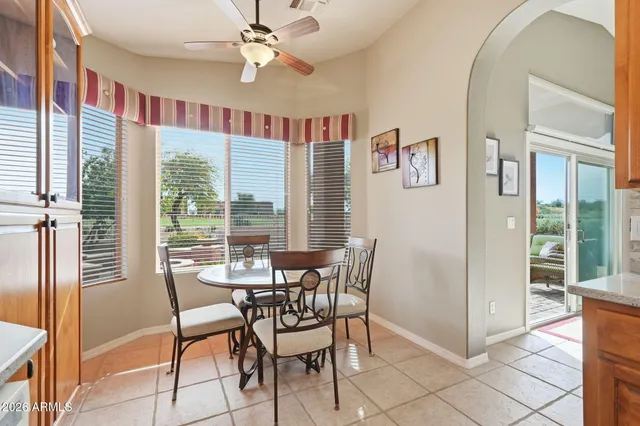 a view of a dining room with furniture window and outside view