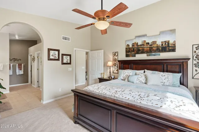 a bedroom with a bed and a dresser