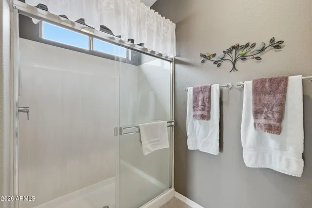 a bathroom with a bathtub and shower