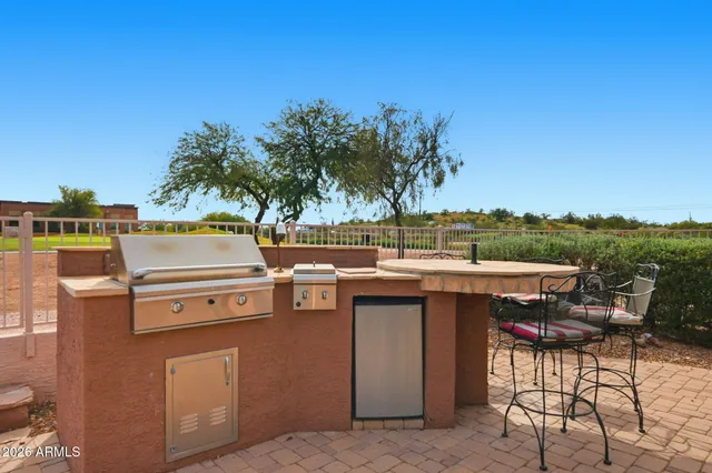 a view of a kitchen with a stove and a table