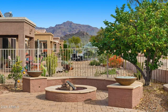a patio with a table and chairs