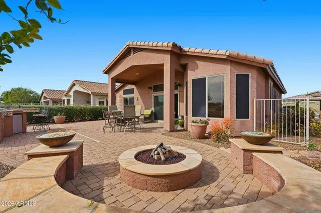 a view of a house with backyard porch and patio