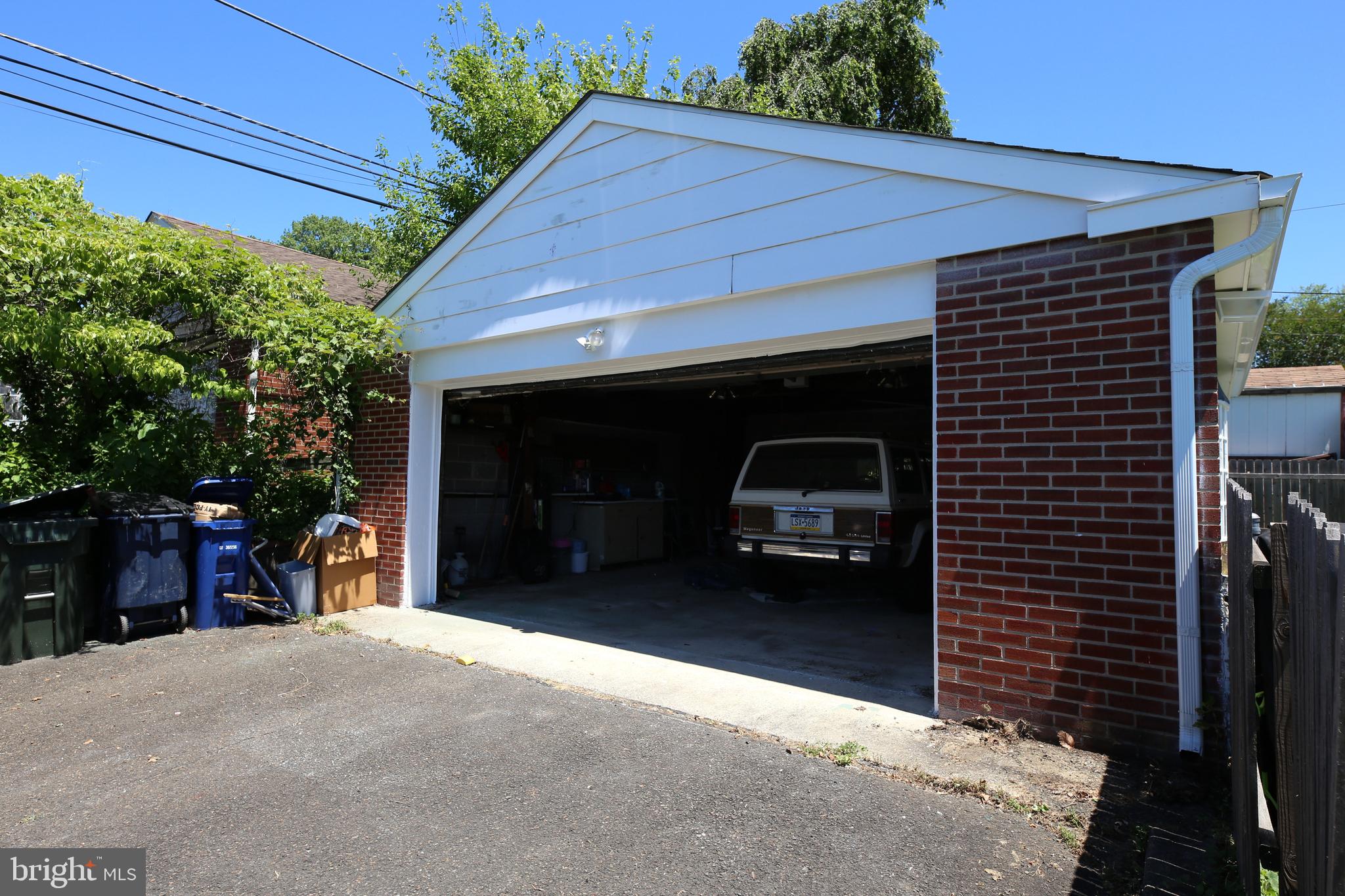 504 Louise Road Glenside, PA 19038 - Photo 34 of 41 Charming garage with lush greenery.