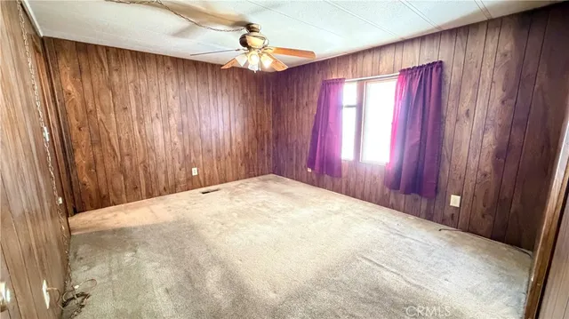 a view of a door and wooden walls