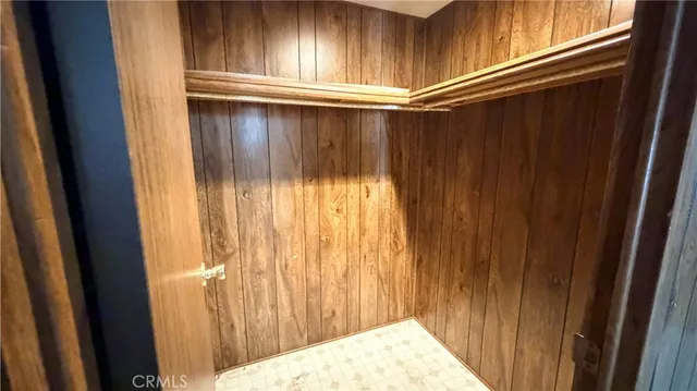 a bed room with a bed and a chandelier