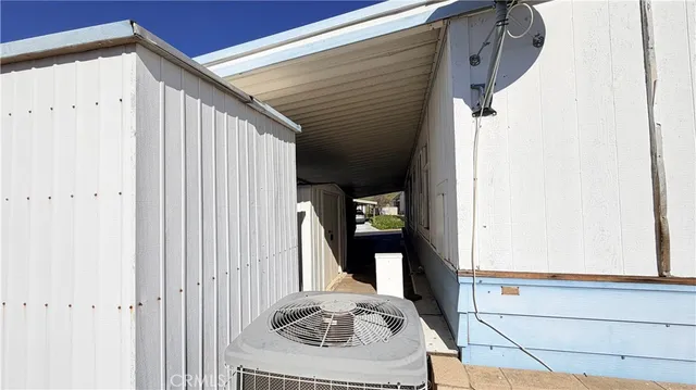 a view of a porch with wooden walls