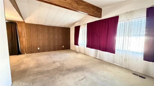 a kitchen with granite countertop a stove and a refrigerator