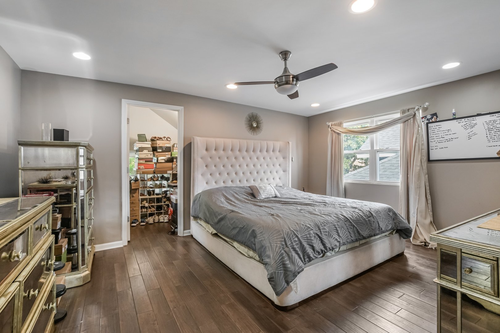 1523 East 85th Street Chicago, IL 60619 - Photo 13 of 27 a bedroom with a bed wooden floor and a window