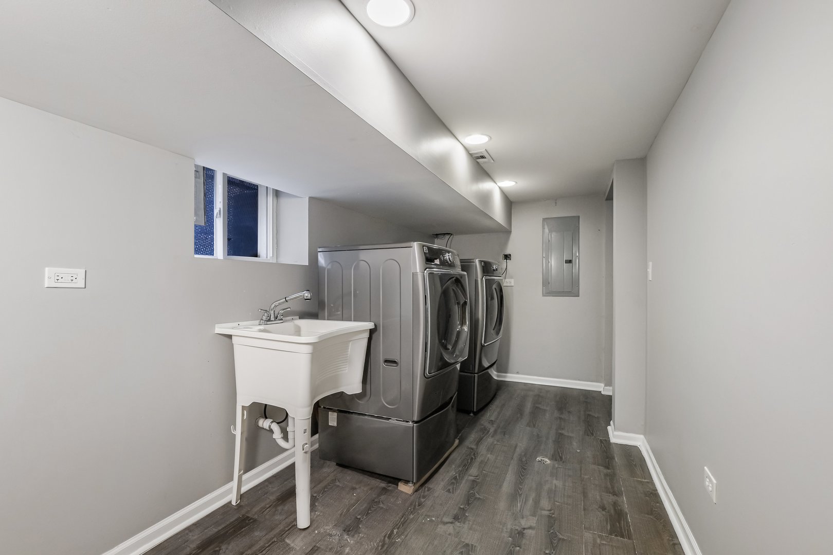 1523 East 85th Street Chicago, IL 60619 - Photo 18 of 27 a view of a storage & utility room with washer and dryer