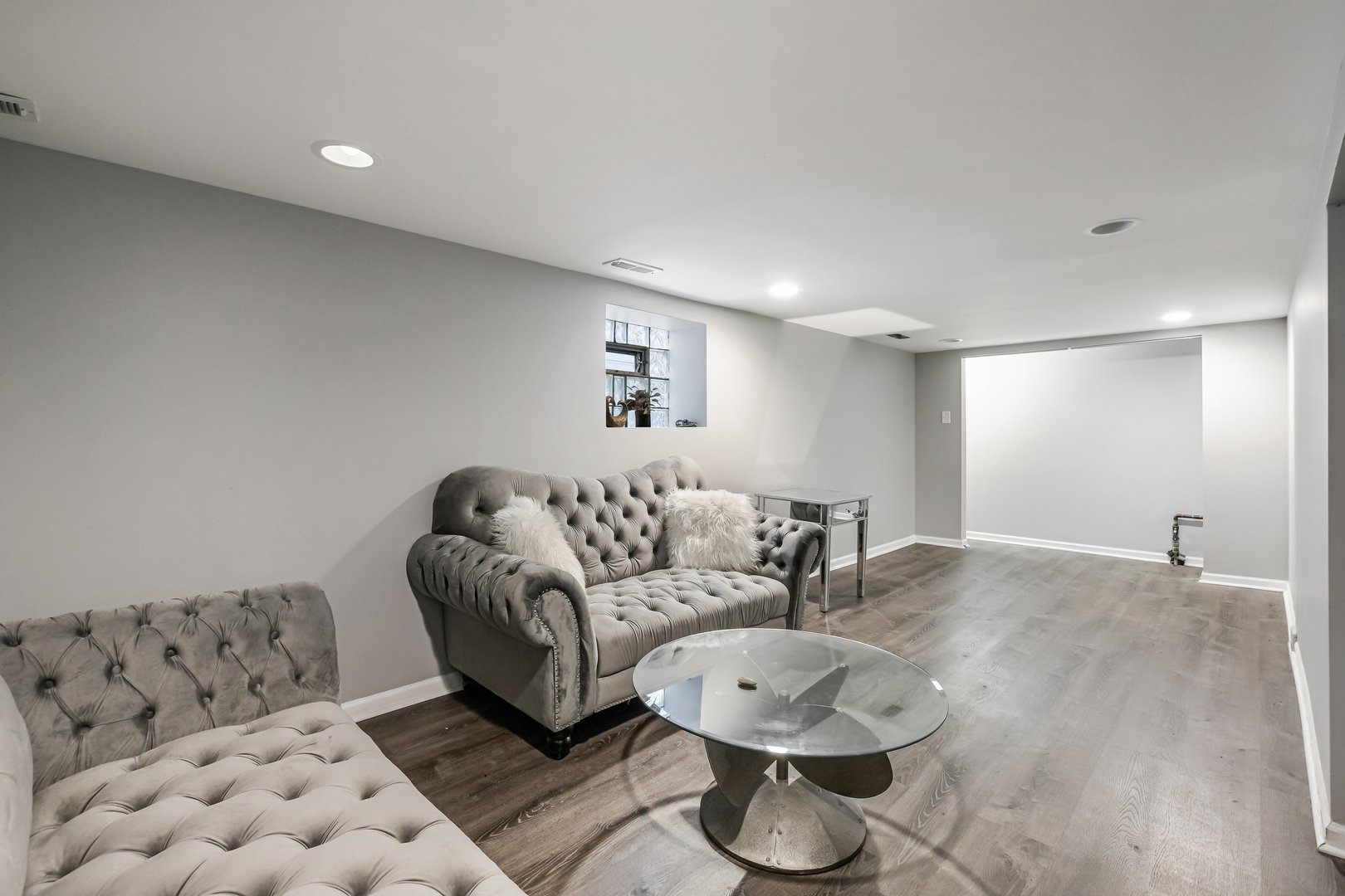 1523 East 85th Street Chicago, IL 60619 - Photo 19 of 27 a living room with furniture and white walls