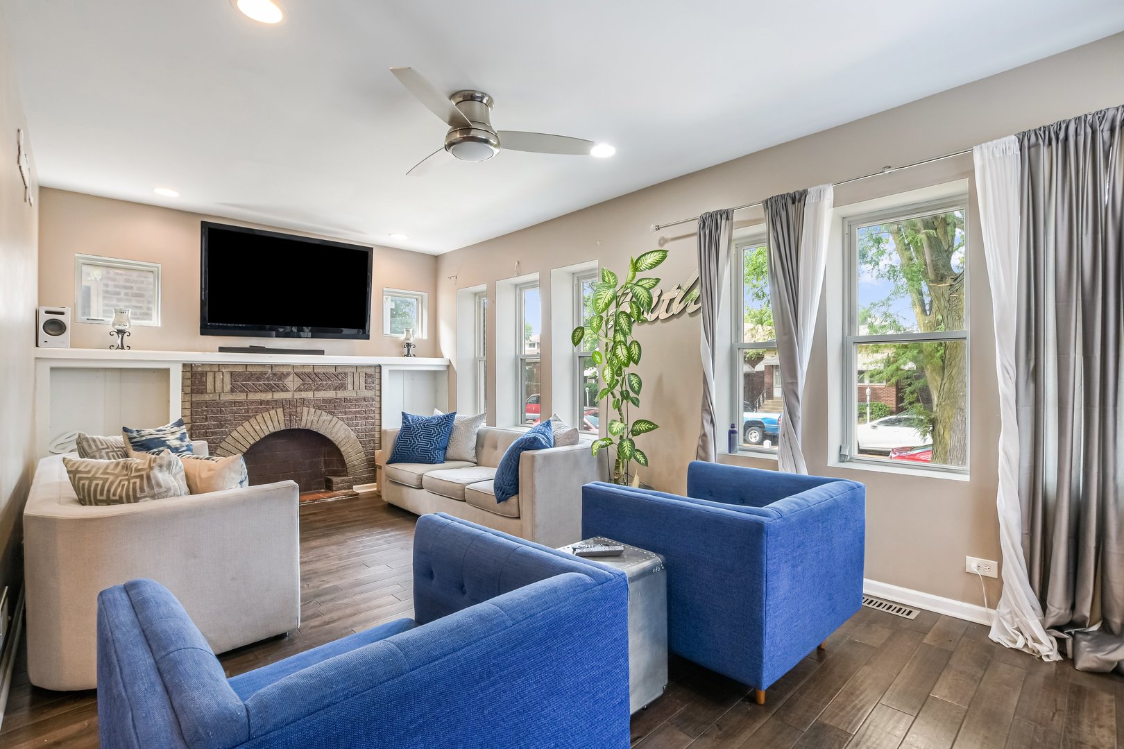 1523 East 85th Street Chicago, IL 60619 - Photo 5 of 27 a living room with furniture fireplace and flat screen tv