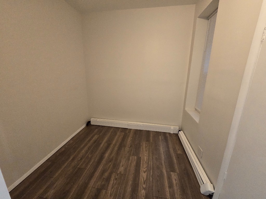 750 Glenmore Avenue, Unit 1 Brooklyn, NY 11208 - Photo 6 of 6 a view of a small space with wooden floor