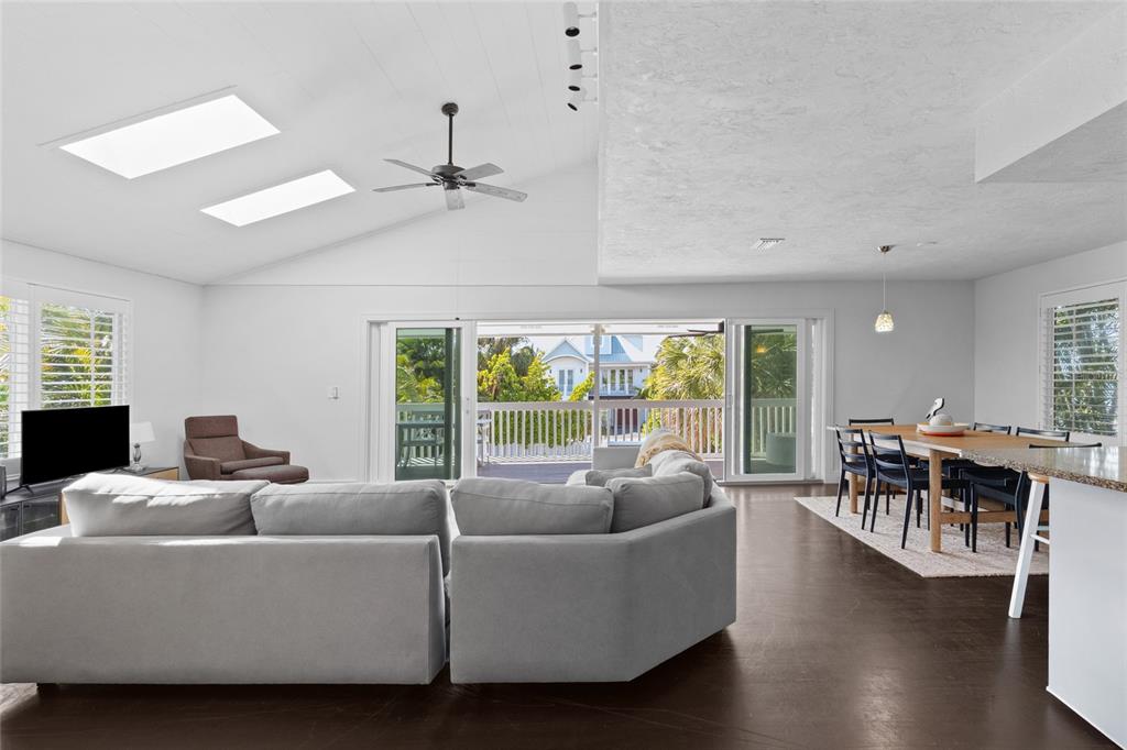315 Spring Avenue Anna Maria, FL 34216 - Photo 8 of 63 a living room with furniture and a large window