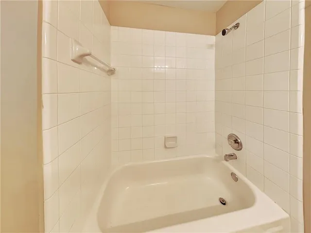 a close up of a bathtub in a bathroom