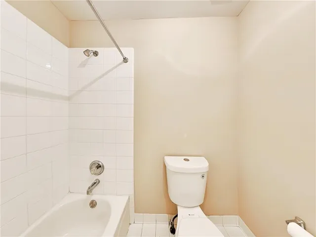 a bathroom with a toilet and a bathtub