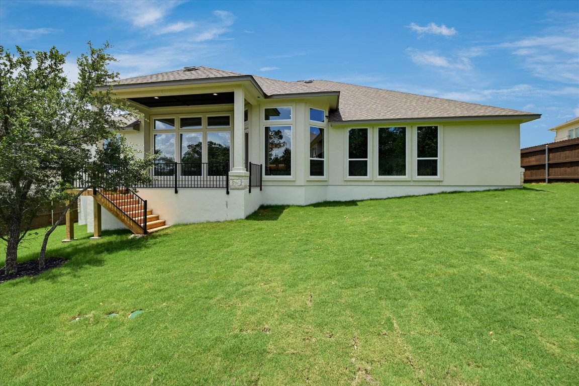 1221 Stormy Drive Georgetown, TX 78628 - Photo 32 of 33 a view of a house with backyard and porch