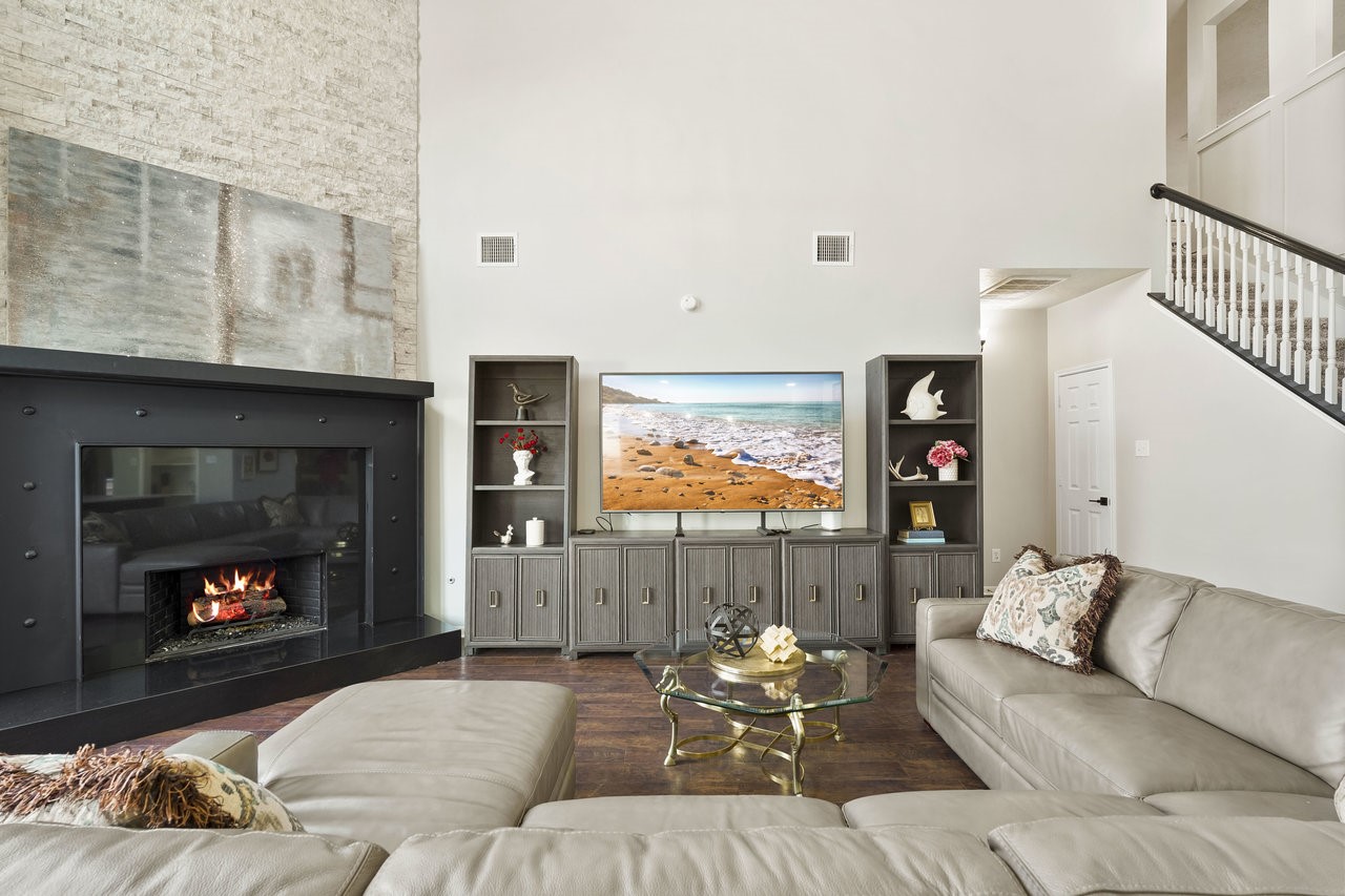8615 Discus Drive Humble, TX 77346 - Photo 19 of 50 a living room with furniture and a fireplace