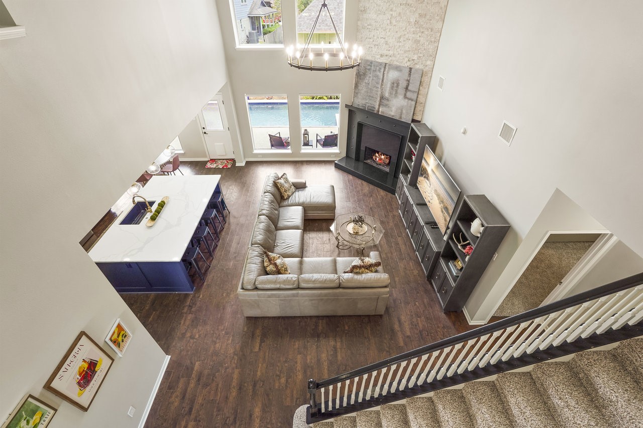 8615 Discus Drive Humble, TX 77346 - Photo 22 of 50 a living room with furniture and a fireplace