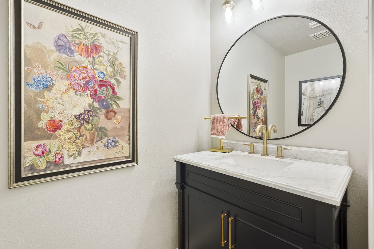 8615 Discus Drive Humble, TX 77346 - Photo 24 of 50 a bathroom with a sink and a mirror