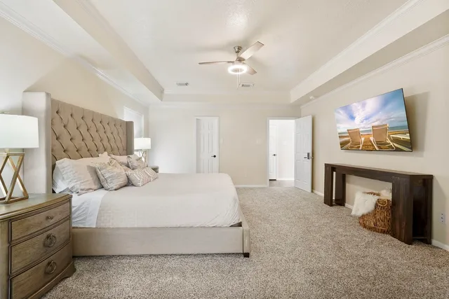 a bedroom with a bed and a fireplace