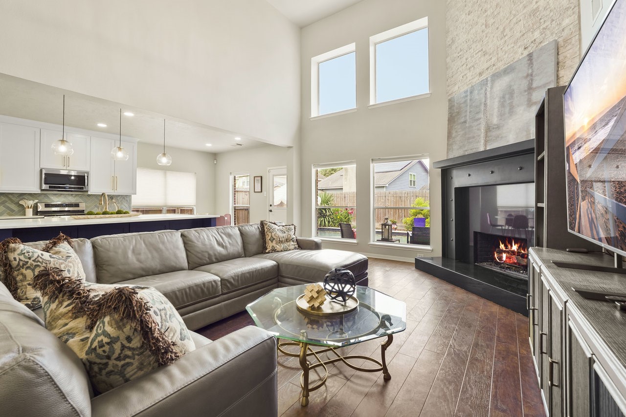 8615 Discus Drive Humble, TX 77346 - Photo 3 of 50 a living room with furniture and a flat screen tv