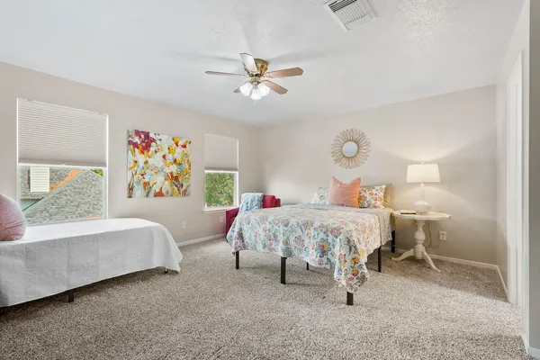 a bed room with a bed and a couch