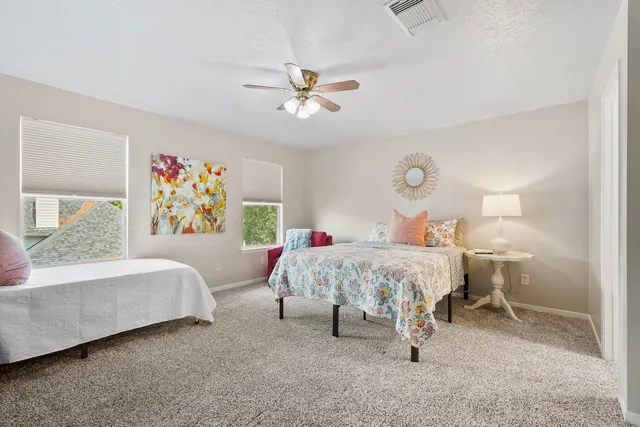 a bed room with a bed and a couch