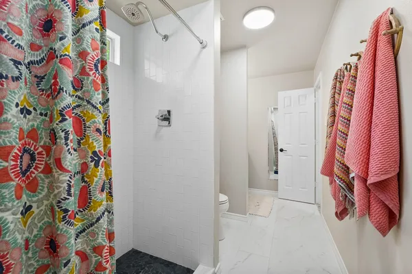 a bathroom with a sink and a curtain