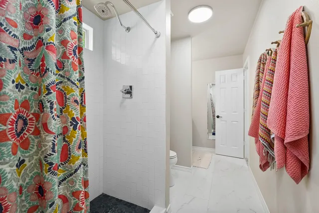 a bathroom with a sink and a curtain
