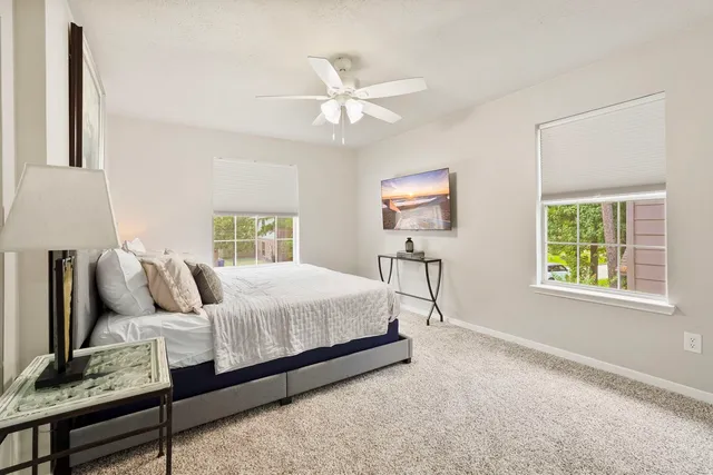 a bedroom with bed and window