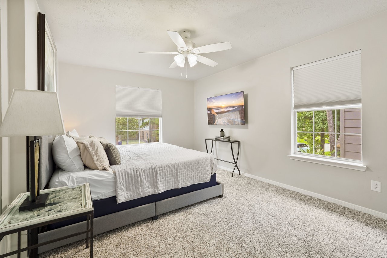 8615 Discus Drive Humble, TX 77346 - Photo 39 of 50 a bedroom with bed and window